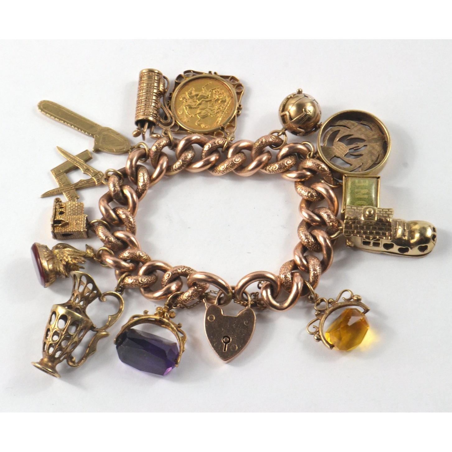Lot 120 - A 9ct gold charm bracelet